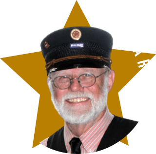 Odznaka: napis "Wybór Kolejarza" i zdjęcie tegoż kolejarza